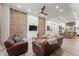 Cozy living room featuring exposed brick, modern furnishings, and hardwood floors at 2318 Arapahoe St, Denver, CO 80205