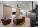 Spacious living room boasts exposed brick walls and modern design at 2318 Arapahoe St, Denver, CO 80205