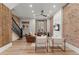 Stylish living room features exposed brick walls, wood floors, and comfortable seating at 2318 Arapahoe St, Denver, CO 80205