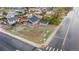 This aerial view showcases a charming home with a spacious yard on a corner lot in a quiet neighborhood at 400 Division Blvd, Platteville, CO 80651