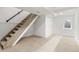 Basement area with neutral carpet and stairs at 400 Division Blvd, Platteville, CO 80651