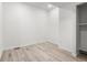 Bright bedroom features wood-look floors, white walls, and a closet at 400 Division Blvd, Platteville, CO 80651