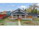 Charming home featuring a cozy front porch, complemented by a well-maintained yard and classic architectural details at 400 Division Blvd, Platteville, CO 80651