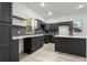 Well-lit kitchen features ample counter space, dark cabinets, and stainless steel sink at 400 Division Blvd, Platteville, CO 80651