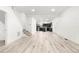 The open floor plan has wood-style floors, recessed lights and stairs to the second floor at 400 Division Blvd, Platteville, CO 80651