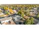 A serene aerial view of a neighborhood with tree-lined streets and well-maintained homes in a peaceful community at 977 S Salida St, Aurora, CO 80017