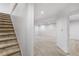 Spacious basement featuring neutral carpet flooring and bright overhead lighting at 977 S Salida St, Aurora, CO 80017