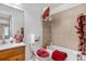 Cozy bathroom with a combined bathtub and shower and modern fixtures at 977 S Salida St, Aurora, CO 80017