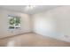 Well-lit bedroom with a large window, offering ample natural light and hardwood floors at 977 S Salida St, Aurora, CO 80017