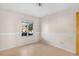 Bright bedroom with natural light coming through a large window and clean, neutral walls at 977 S Salida St, Aurora, CO 80017