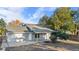 Charming single-story home featuring a covered porch and attached garage, complemented by a well-maintained yard at 977 S Salida St, Aurora, CO 80017