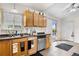Kitchen featuring stainless steel dishwasher, wood cabinets, and lots of counter space at 977 S Salida St, Aurora, CO 80017