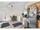 Cozy kitchen with dining area featuring stainless steel appliances, tile flooring, and plenty of storage space at 977 S Salida St, Aurora, CO 80017