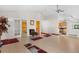 Bright and airy living room with vaulted ceilings and an open layout, leading to the kitchen at 977 S Salida St, Aurora, CO 80017