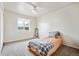 Bright bedroom with ample natural light and a comfortable area rug at 961 S Miller Way, Lakewood, CO 80226