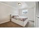 Cozy bedroom with built in storage under bed, carpet, and neutral colors at 961 S Miller Way, Lakewood, CO 80226