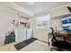 Functional laundry room with washer, dryer, shelving, and a work-from-home space at 961 S Miller Way, Lakewood, CO 80226
