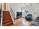 Hardwood stairs and floors, combined with ample natural light, make this living room a comfortable and inviting space at 961 S Miller Way, Lakewood, CO 80226