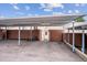 Covered parking with access to a storage unit and exterior door at 961 S Miller Way, Lakewood, CO 80226