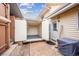 Enclosed patio leading to external storage space with roll away doors at 961 S Miller Way, Lakewood, CO 80226