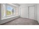 Sun-filled bonus room featuring a window seat and a closet with sliding doors at 8603 E Dry Creek Rd # 214, Englewood, CO 80112