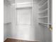 Organized walk-in closet with custom shelving and ample storage space for clothing at 8603 E Dry Creek Rd # 214, Englewood, CO 80112