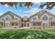 Beautiful condo complex with manicured lawn and charming architectural details, perfect for comfortable living at 8603 E Dry Creek Rd # 214, Englewood, CO 80112