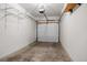 Spacious garage with a garage door and lots of room for vehicle and storage at 8603 E Dry Creek Rd # 214, Englewood, CO 80112