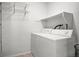 Functional laundry room with a washer, a dryer, and storage shelves at 8603 E Dry Creek Rd # 214, Englewood, CO 80112