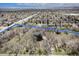 High-angle view emphasizing the property's setting near established neighborhoods and scenic landscapes at 9350 W Florida Ave, Lakewood, CO 80232