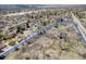 Stunning aerial view of the property's location, surrounded by lush greenery and mature trees at 9350 W Florida Ave, Lakewood, CO 80232