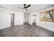 Bright bedroom with hardwood floors, neutral walls, a large window and ample closet space at 9350 W Florida Ave, Lakewood, CO 80232