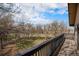 Spacious deck with lovely views of mature trees, landscaping and distant road at 9350 W Florida Ave, Lakewood, CO 80232