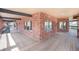 Wrap-around wooden deck with brick details, offering ample space and scenic views at 9350 W Florida Ave, Lakewood, CO 80232