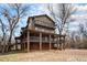Beautifully designed three-story home featuring balconies and a brick foundation at 9350 W Florida Ave, Lakewood, CO 80232