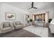 Bright home office features hardwood floors, neutral paint, a modern ceiling fan and outdoor views at 9350 W Florida Ave, Lakewood, CO 80232