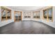Open concept living room with hardwood floors, natural light from multiple windows and balcony access at 9350 W Florida Ave, Lakewood, CO 80232