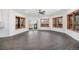 Open concept living room features beautiful hardwood floors, natural light from many windows and patio access at 9350 W Florida Ave, Lakewood, CO 80232