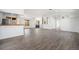 Open floor plan with lots of windows, wood floors and views into other rooms at 9350 W Florida Ave, Lakewood, CO 80232