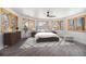 Serene main bedroom with hardwood floors, plenty of natural light, and a modern ceiling fan at 9350 W Florida Ave, Lakewood, CO 80232