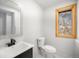 Neat powder room with modern fixtures and lovely natural light at 9350 W Florida Ave, Lakewood, CO 80232
