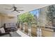 Scenic balcony with comfortable seating offering views of lush greenery and the building at 800 N Washington St # 307, Denver, CO 80203