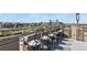 Charming balcony with bar seating and stunning city and mountain views beyond the railings at 800 N Washington St # 307, Denver, CO 80203