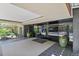 Welcoming building entrance featuring glass doors, tile flooring, and potted plants at 800 N Washington St # 307, Denver, CO 80203