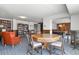 Spacious game room boasts a pool table, cozy seating area, and extensive built-in bookshelves at 800 N Washington St # 307, Denver, CO 80203