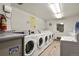 Clean laundry room equipped with multiple washing machines and bright lighting at 800 N Washington St # 307, Denver, CO 80203