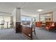 Inviting living room features elegant seating, a decorative mirror and large windows with city views at 800 N Washington St # 307, Denver, CO 80203