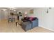Inviting living area showcasing a comfortable sofa and seamless flow to the kitchen with bar stool seating at 800 N Washington St # 307, Denver, CO 80203