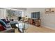 Cozy living room with balcony access, comfortable seating, and natural light at 800 N Washington St # 307, Denver, CO 80203
