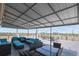 Stylish rooftop deck featuring cushioned seating, a dining area, and panoramic city views at 800 N Washington St # 307, Denver, CO 80203